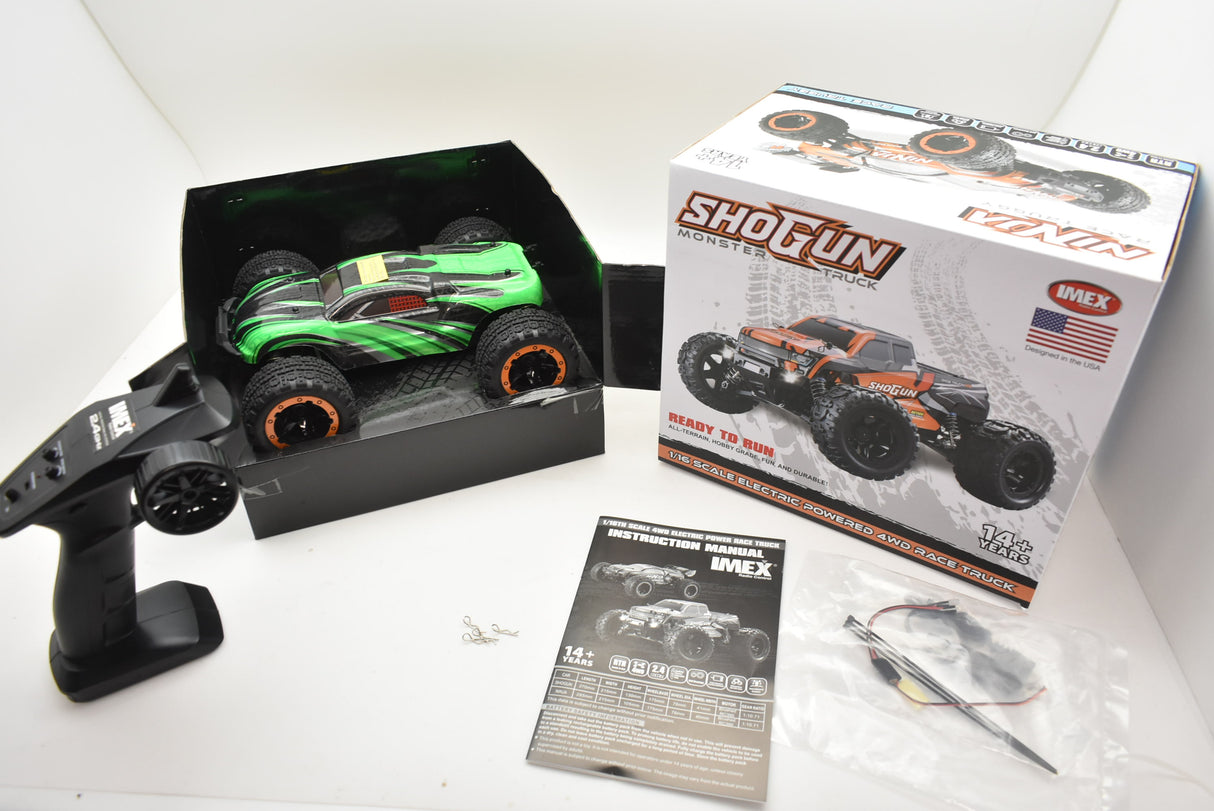 Green and orange remote-controlled monster truck in its open box for ORANGE/GREEN IMX19025, package view, product view 10