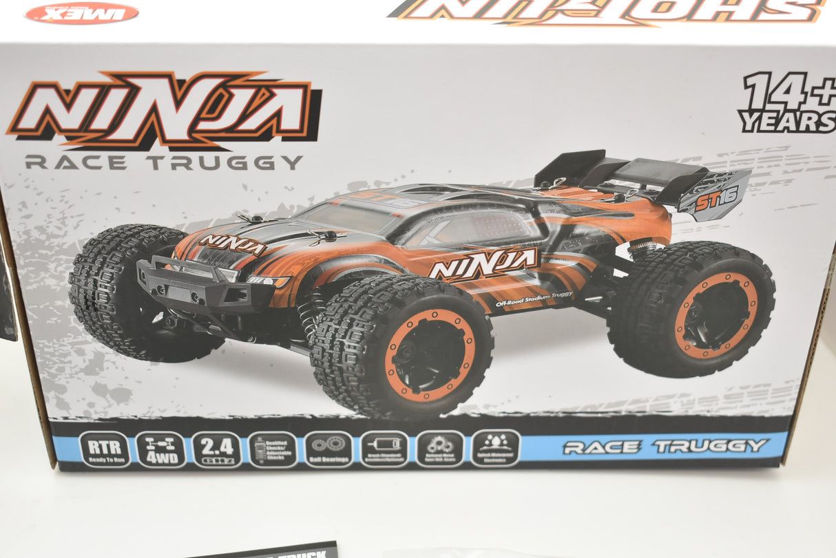 Orange and green remote-controlled monster truck on a box for ORANGE/GREEN IMX19025, package view, product view 14