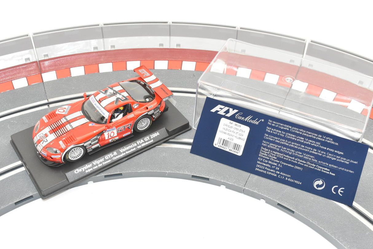 Red race car model on a track display with branding and safety warnings for Fly Car 88109