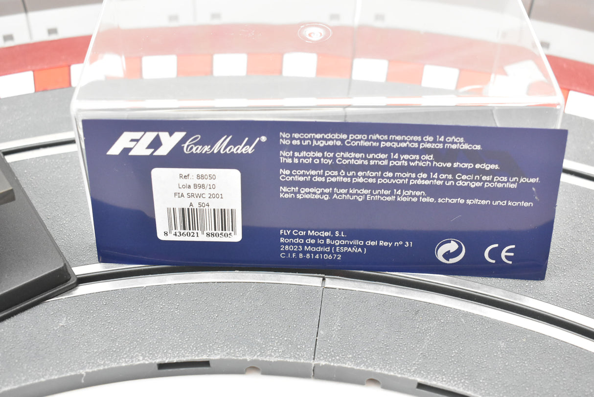 Product packaging showing safety warnings and model details for a toy car for Fly Car Fia Srwc 2001