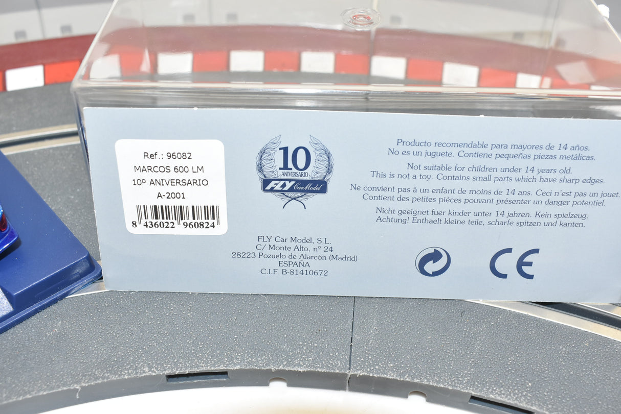 Product packaging showing safety warnings and model details for a toy car for Fly Car 10 Anicersario