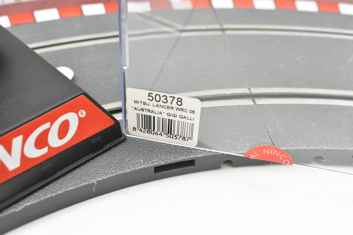 Race track with product card for Mitsubishi Lancer WRC 2006 "Australia" for Ninco 50378