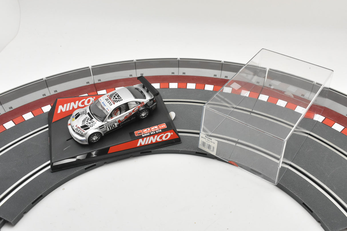 Slot car BMW M3 race car on a track section for Ninco 50288