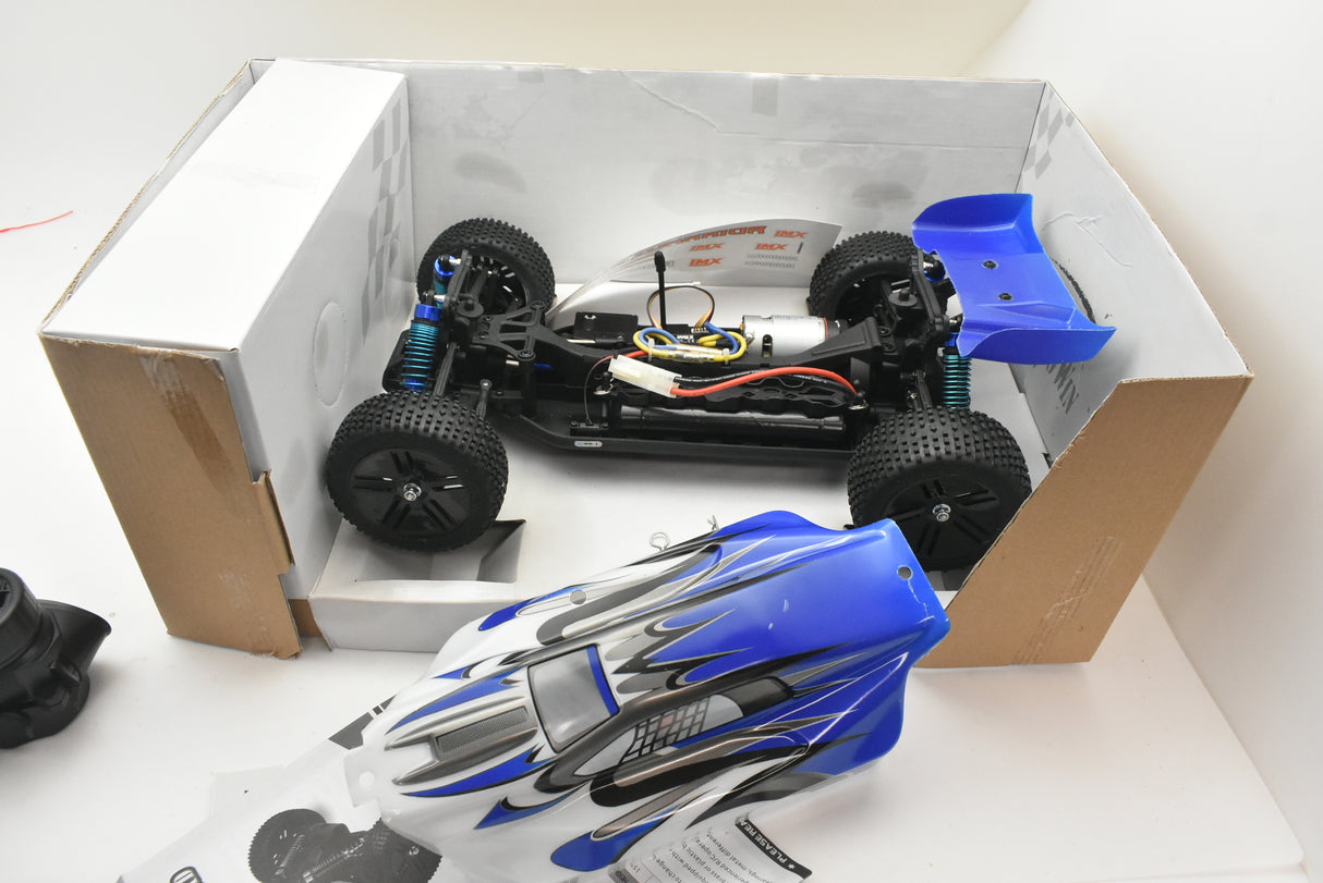 RC buggy chassis and body shell displayed in an open cardboard box for IMEX 18020, package view, product view 21