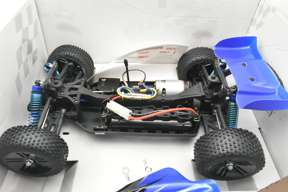 Black RC buggy chassis with wheels and blue body shell in a box for IMEX 18020, package view, product view 22