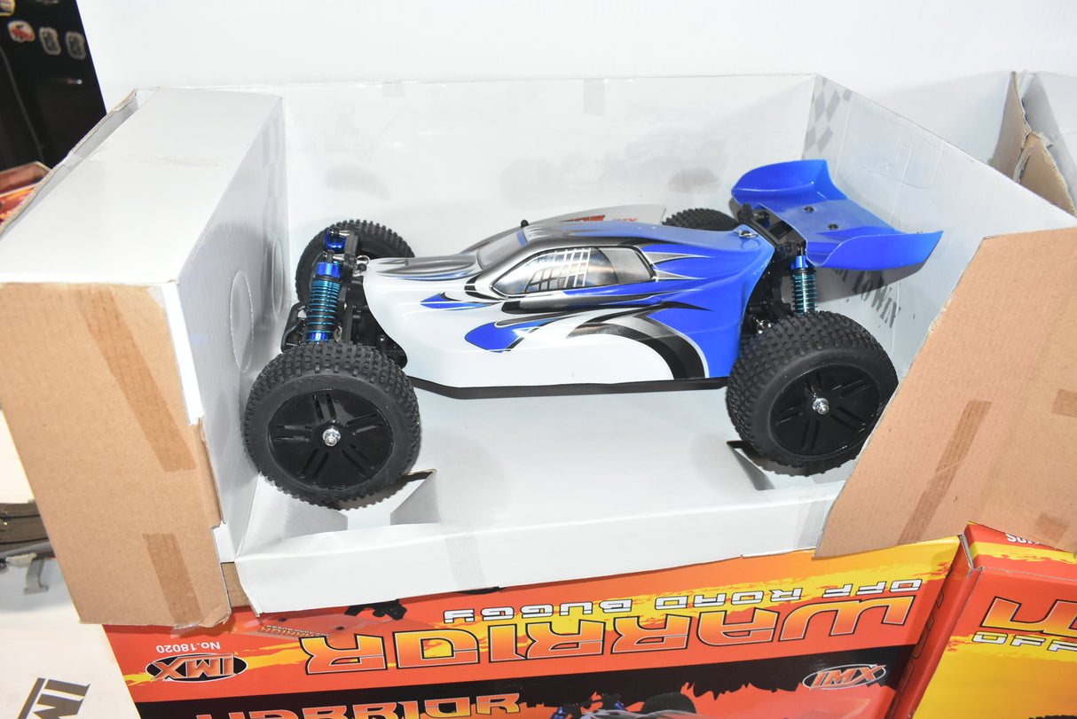 Blue and white RC buggy on a cardboard display box for IMEX 18020
