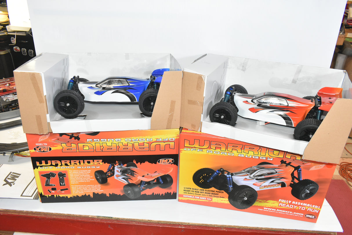 Two sets of remote-controlled buggies in open boxes for IMEX 18020
