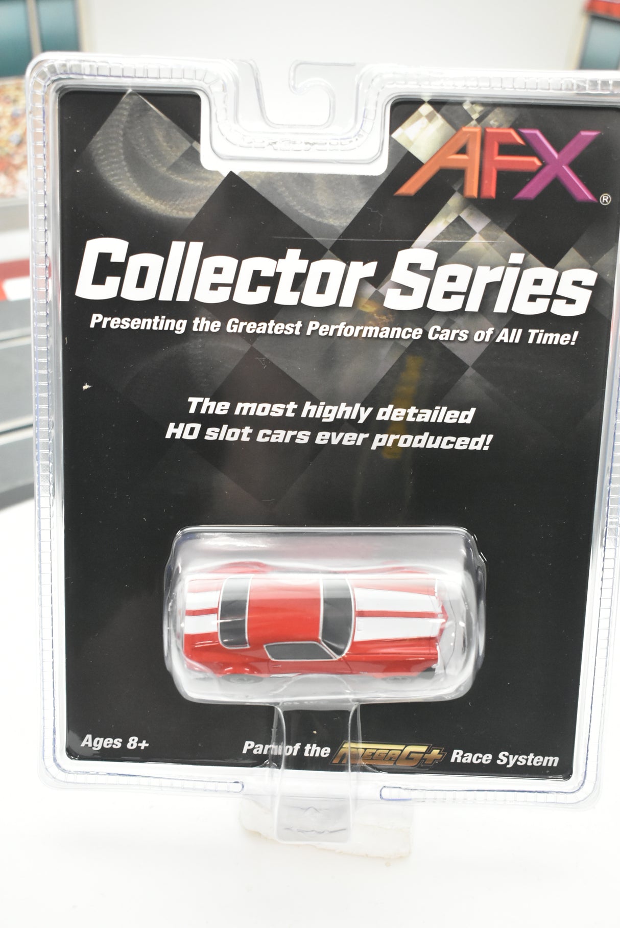 Red Camaro SS350 slot car in collector's packaging for AFX/Racemasters 22002