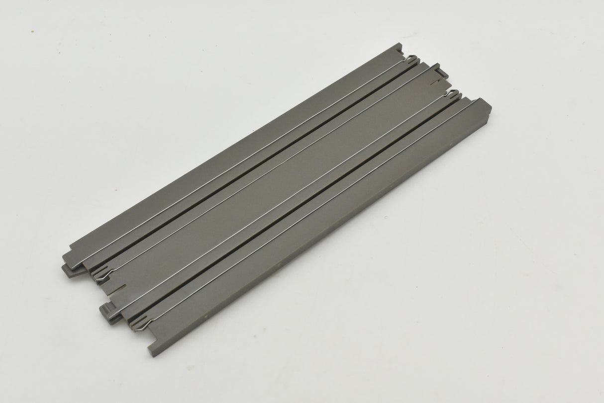 Two straight, metal tracks for hardware, laid out on white for Auto World H006