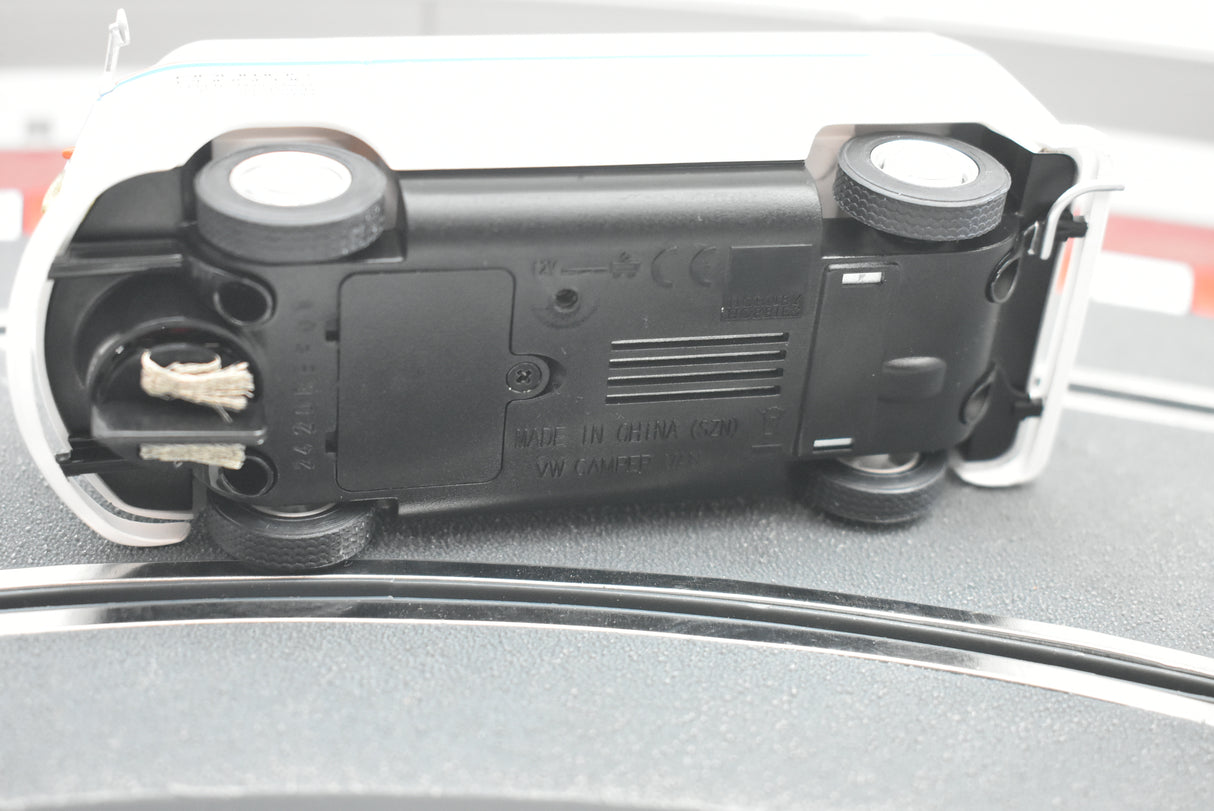 White scale model van viewed from the side, resting on a gray surface for Scalextric C4086