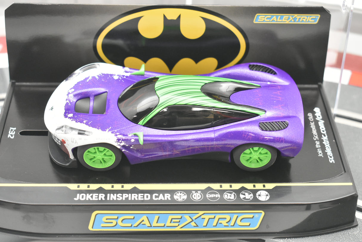 Purple and white slot car, Joker inspired model, on black display base for Scalextric C4142T