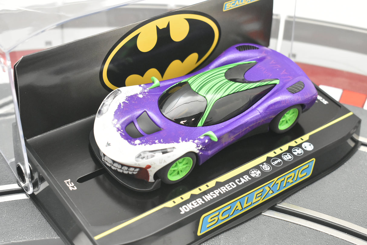 Purple and white Joker-themed slot car on its display base for Scalextric C4142T