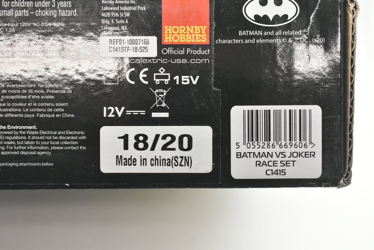 Product packaging showing "Batman vs Joker Race Set" and electrical ratings for Scalextric C415