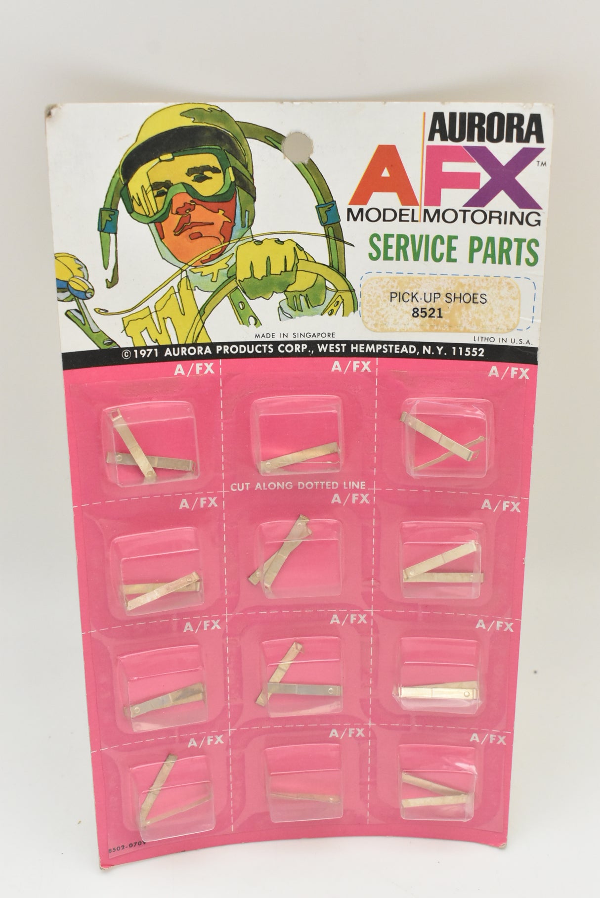Card of 12 pick-up shoes for model cars, Aurora AFX brand for 1 card of 12
