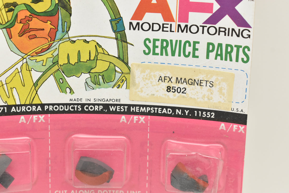 Card packaging showing magnets for model car parts for Aurora / AFX 1 card of 12