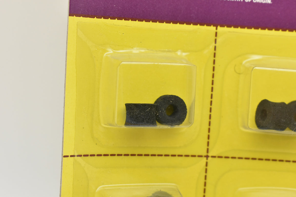 Small black sponge tires arranged in a plastic blister pack for Aurora Model Motoring 1 card of 12/Pk