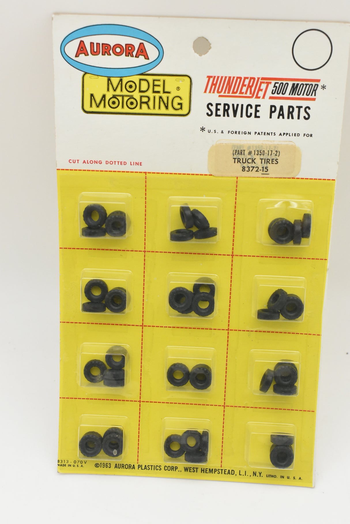 Assortment of small, black rubber tires for model motor parts for Aurora Model Motoring 8372-15, parts view, product view 2