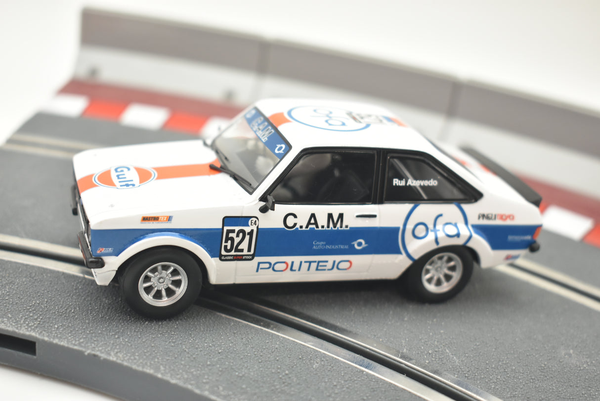 White model race car on track, featuring Gulf livery and racing numbers for Scalextric C4150
