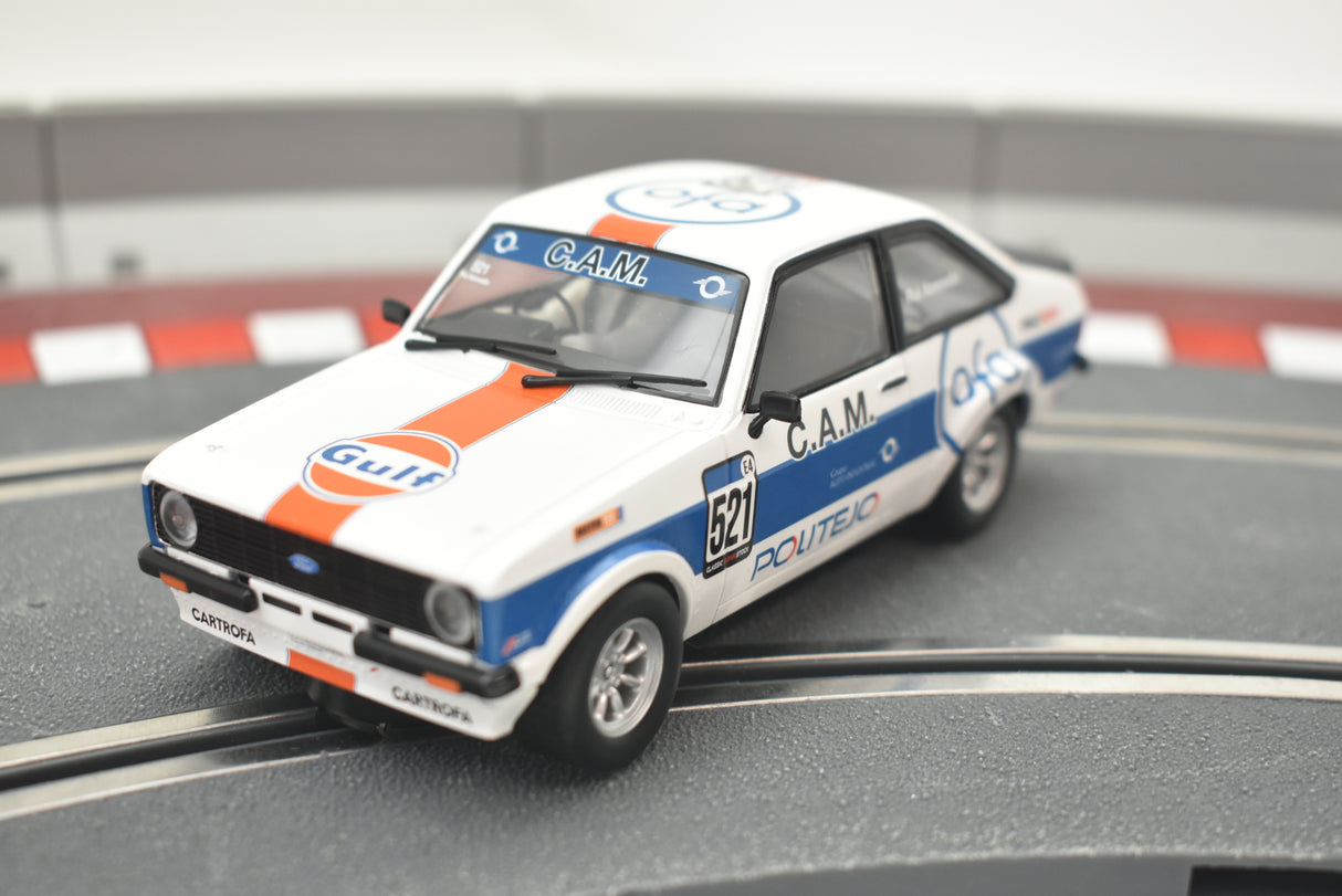 White model car, Ford Escort, with Gulf livery on a track for Scalextric C4150