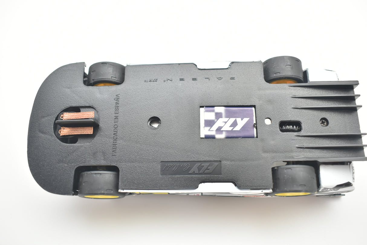 Top view of a black slot car, showing undercarriage details for Fly Car 88044