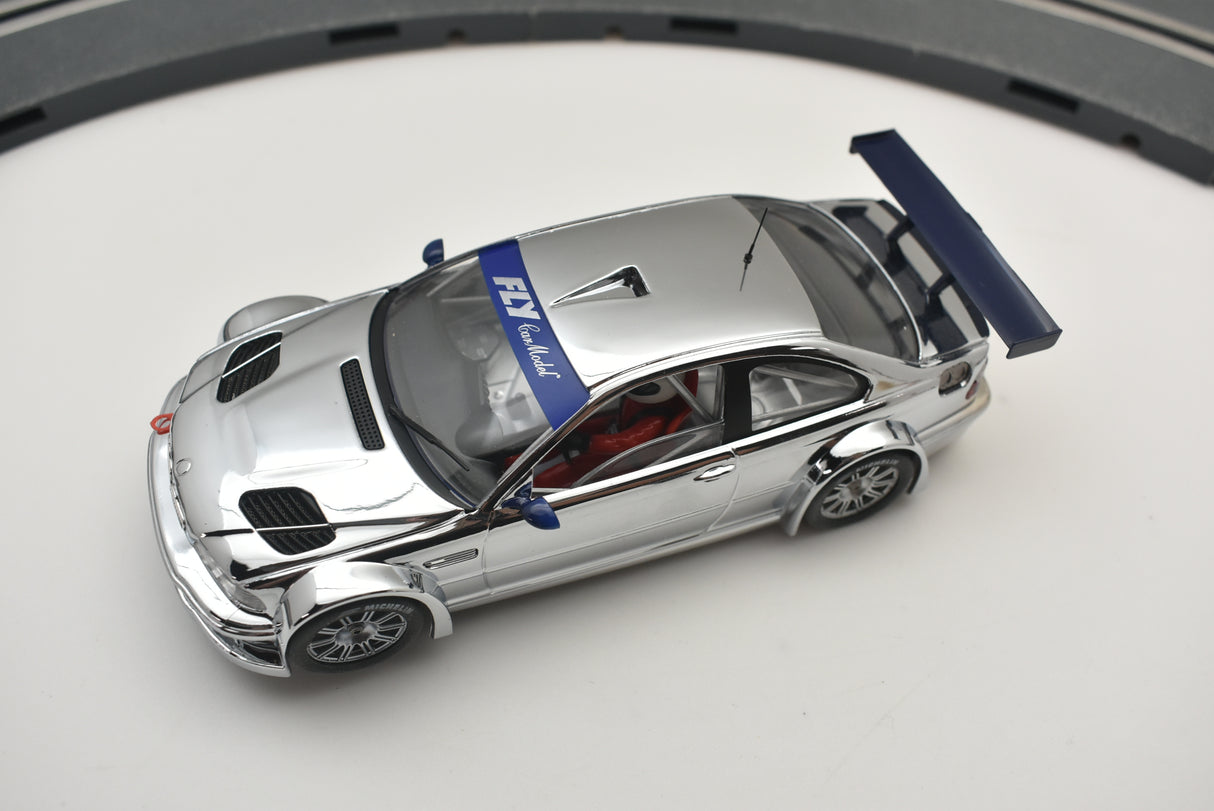 Silver slot car with open hood and blue accents for Fly Car 88040