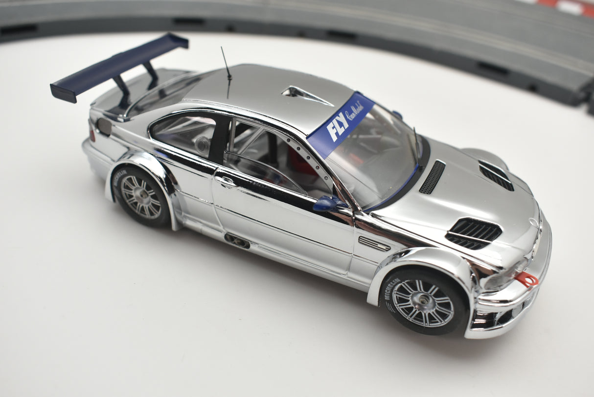 Silver slot car with a rear wing on a track for Fly Car 88040