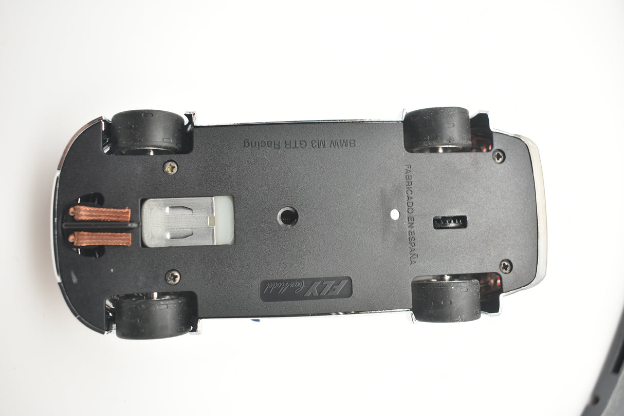 Underside view of a slot car showing undercarriage details for Fly Car 88040
