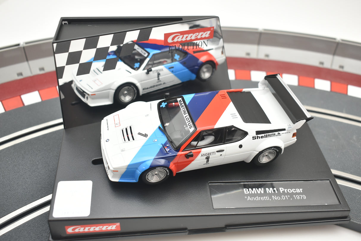 White and blue BMW M1 race car model on a track base for Carrera 27560