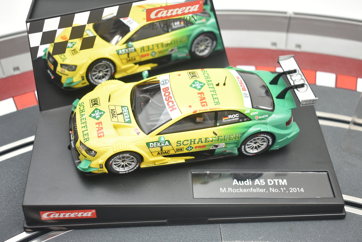 Yellow and green Audi race car model on a black display base for Carrera 274730