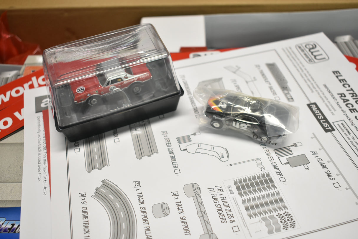 Red and black train car model on a parts list for a model train set for Auto World SRS326, parts view, product view 14
