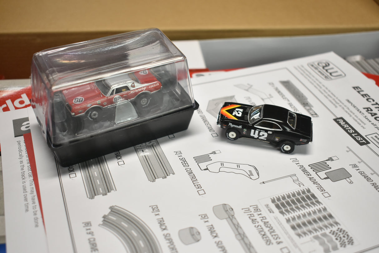 Red and black model train cars on a layout parts diagram for Auto World SRS326, parts view, product view 13