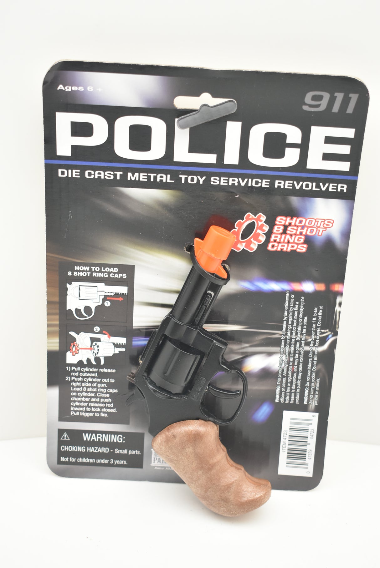 Toy police revolver with ammunition, displayed on packaging for Parris Toys 4723