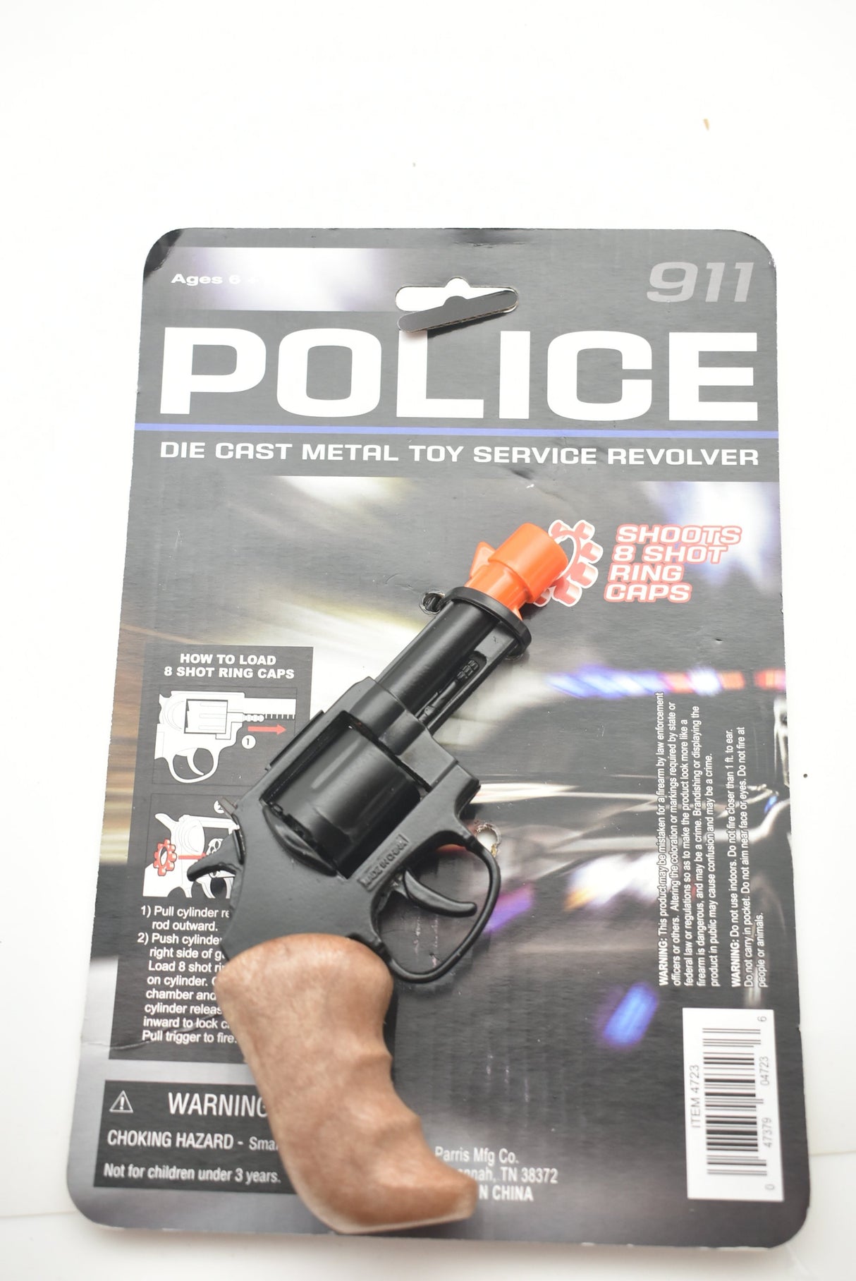Toy police revolver with loading instructions and warning labels for Parris Toys 4723