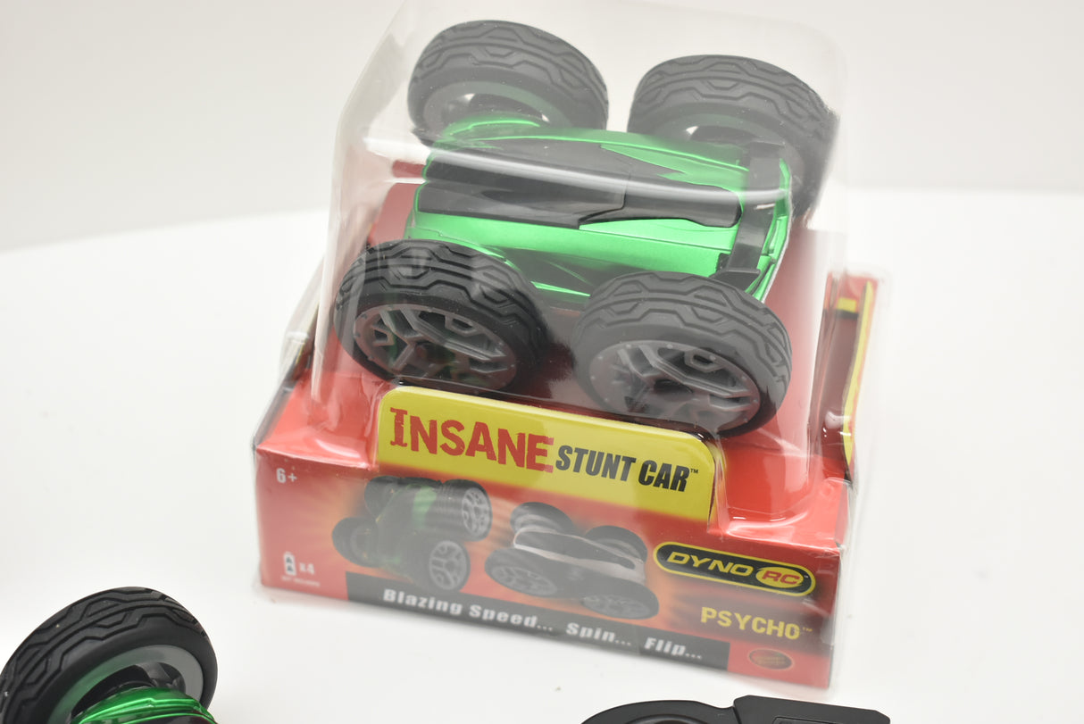 Green and black remote control stunt car in clear plastic packaging for 48000 48000