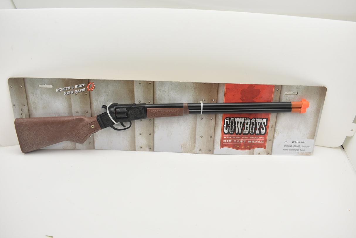Toy rifle with brown stock and metal barrel, displayed on a cardboard backing for Parris Toys 4722