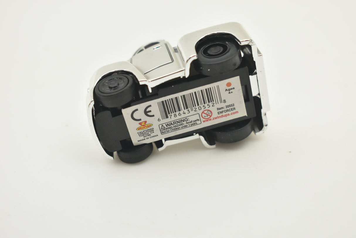 Small, silver and black toy car with visible markings and wheels for California Creations 20553