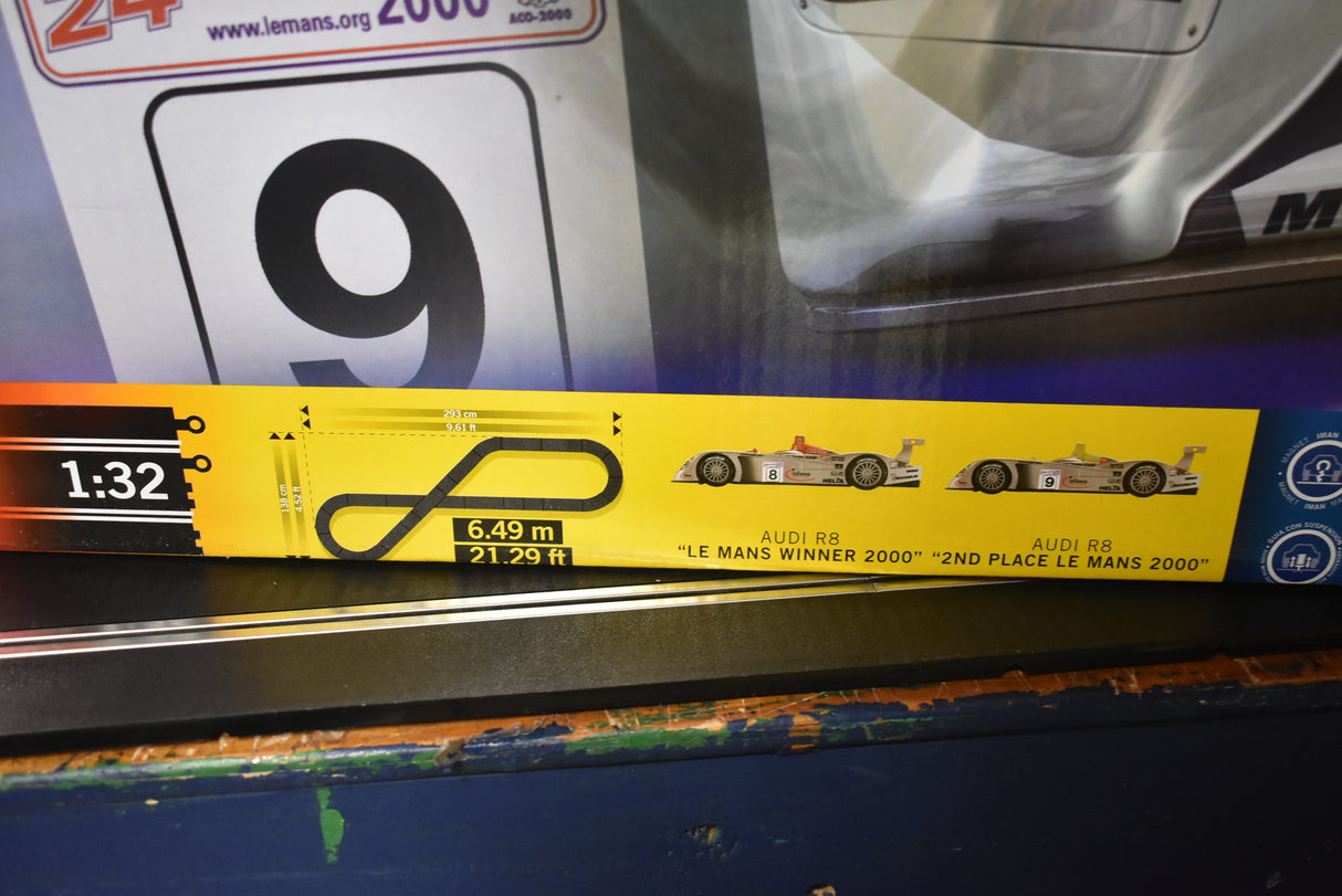 Slot car set packaging showing 1:32 scale and two Audi R8 models for SCX 80500