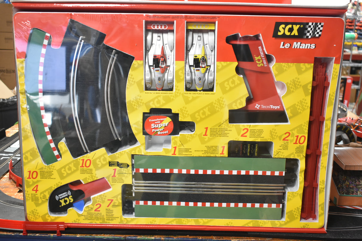 Slot car set box showing cars, track pieces, and accessories for Le Mans racing for SCX 80500