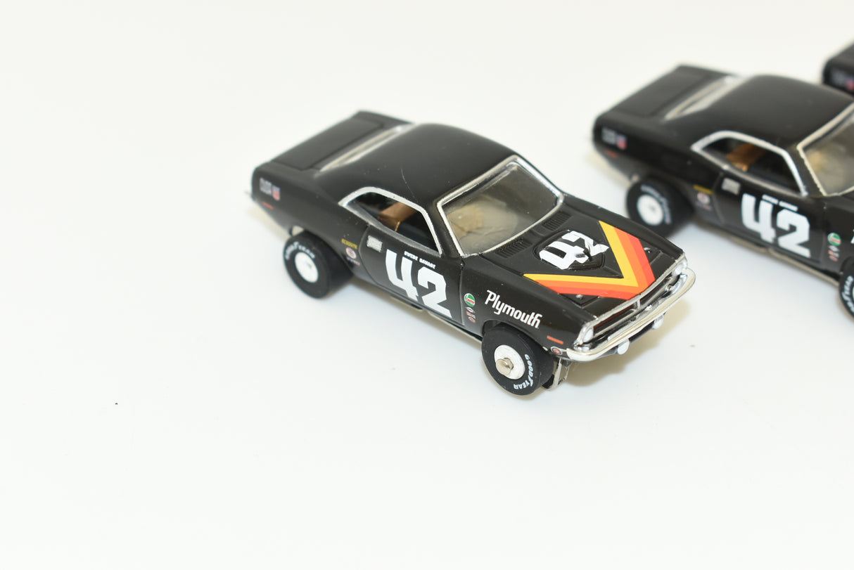 Black 1970 Plymouth 'Cuda slot car model with racing decals for Slot Car 1:64 SC338