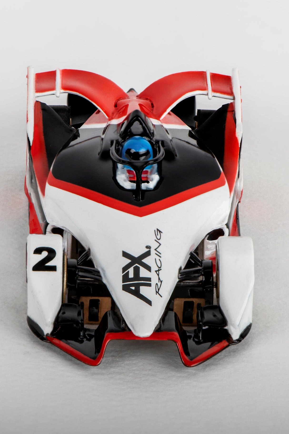 Black, red, and white remote-controlled race car viewed from above for AFX/Racemasters 22015
