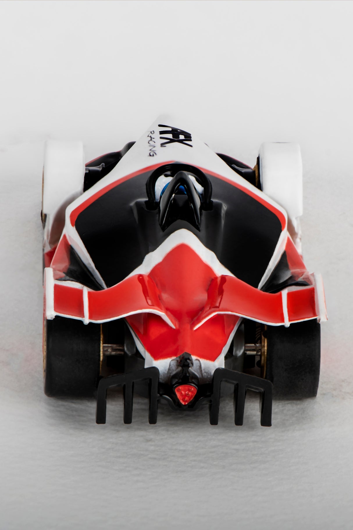 Black, red, and white race car model viewed from the front for AFX/Racemasters 22015