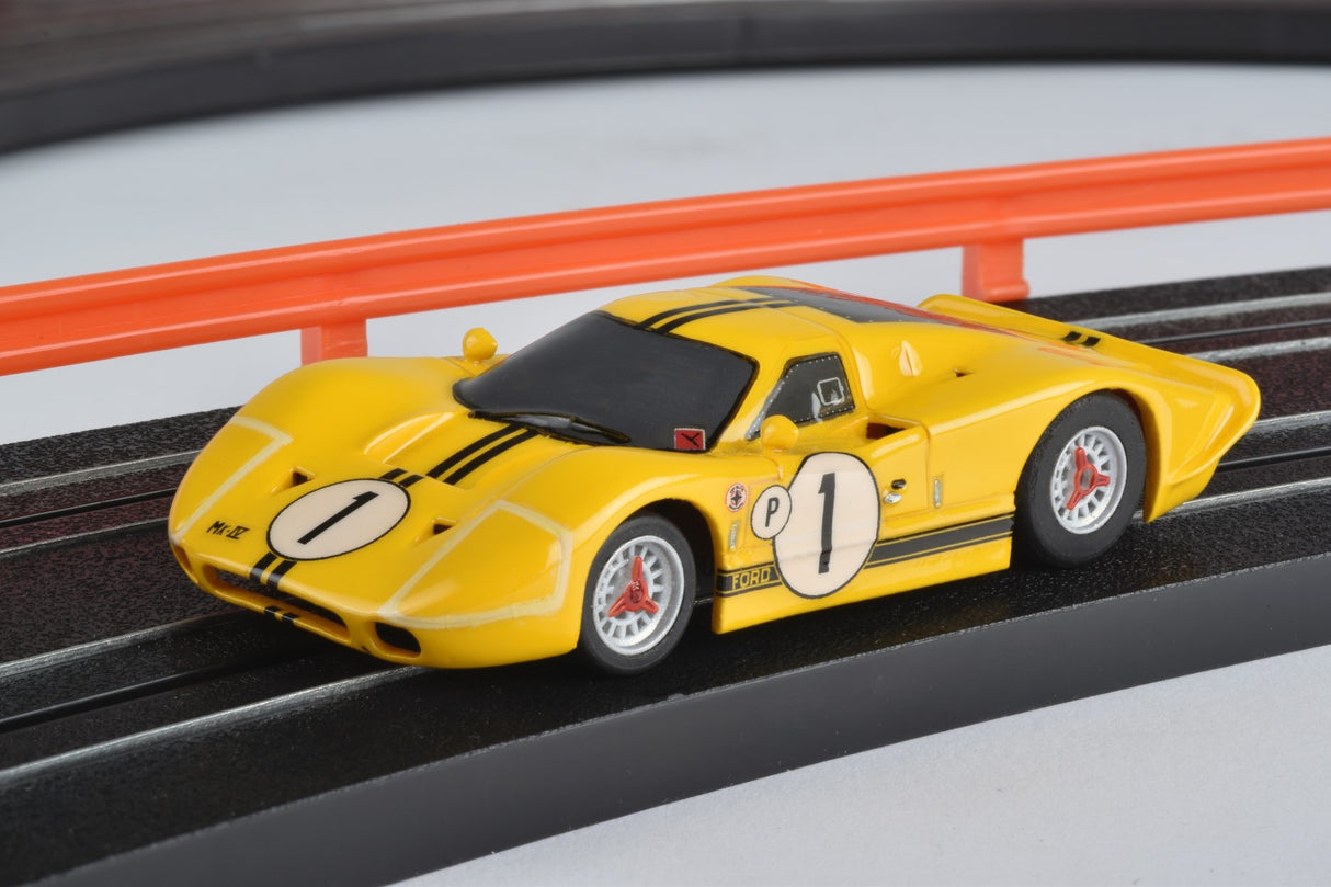 Yellow Ford GT40 race car model on a track for AFX/Racemasters 22025