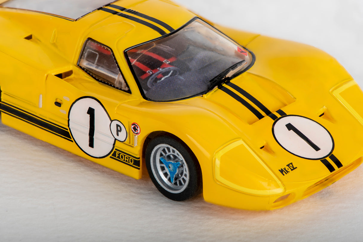 Yellow Ford GT40 race car model with black stripes and number one markings for AFX/Racemasters 22025