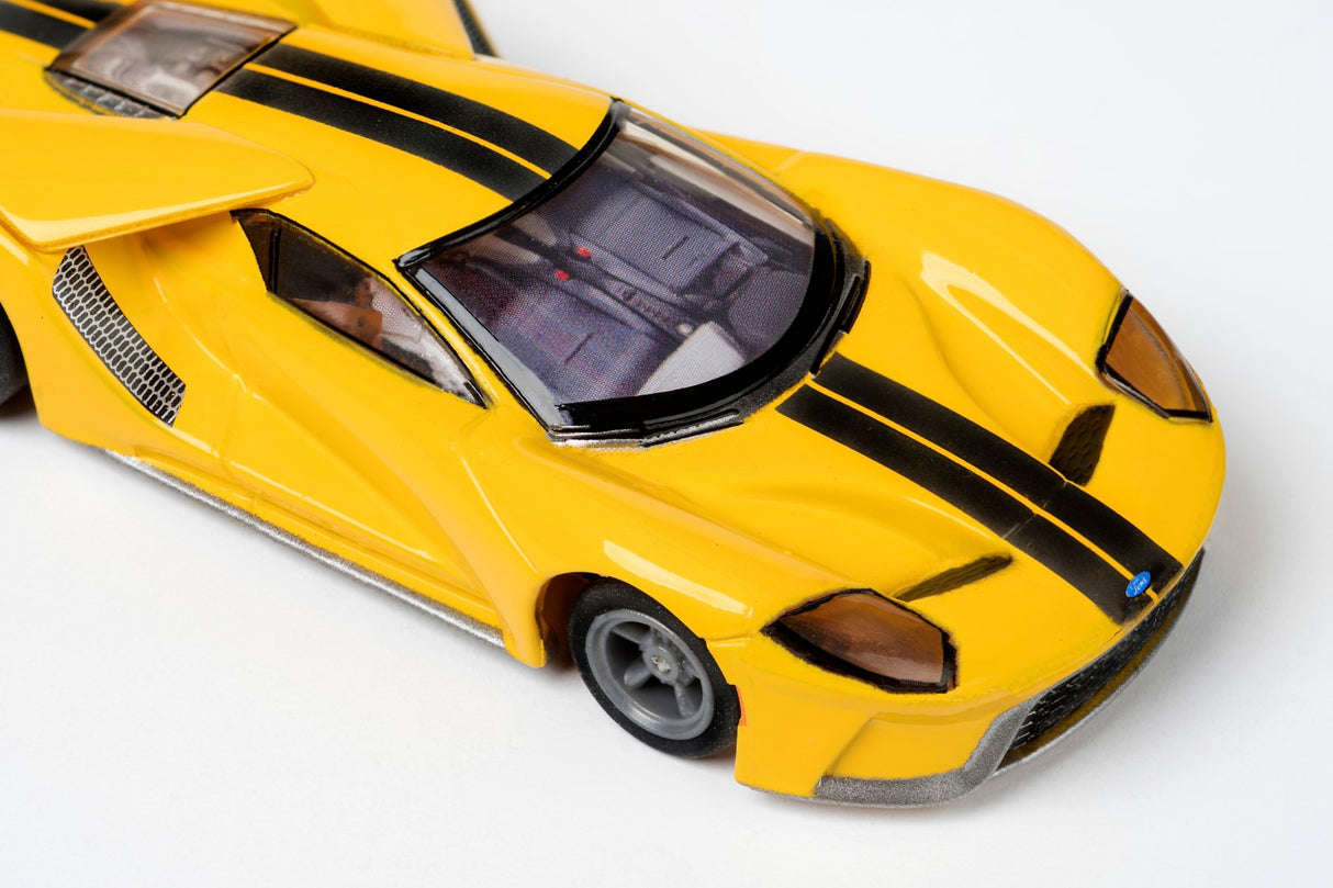 Yellow slot car replica of a Ford GT, viewed from the front corner for AFX/Racemasters 22029 / 21007