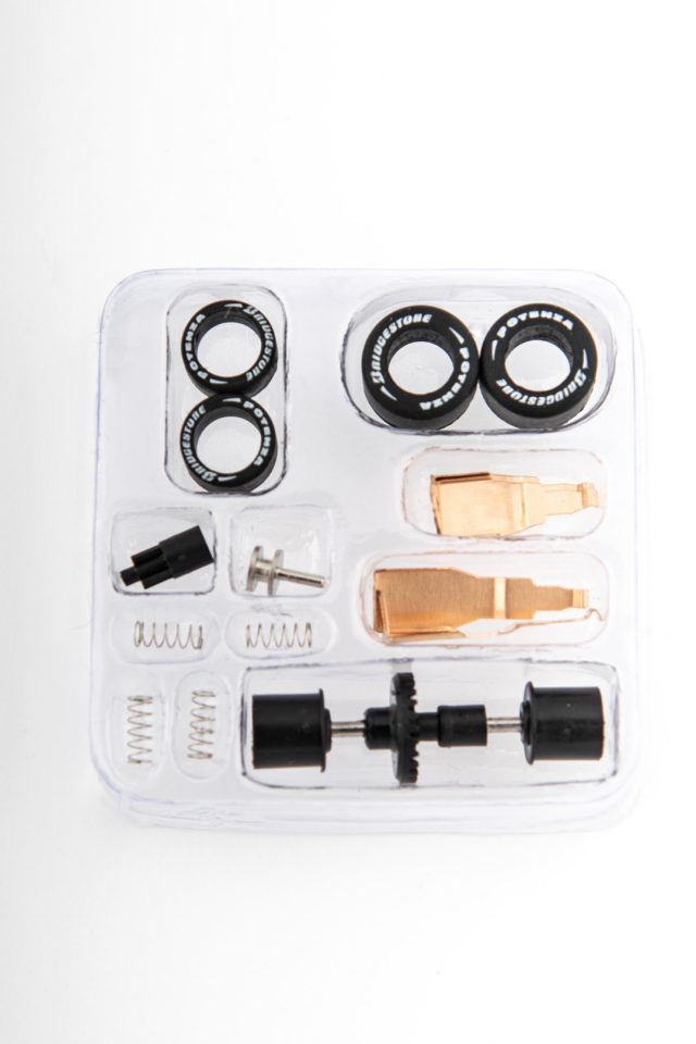 Tire and tuning parts kit in clear plastic packaging for AFX/Racemasters 22036