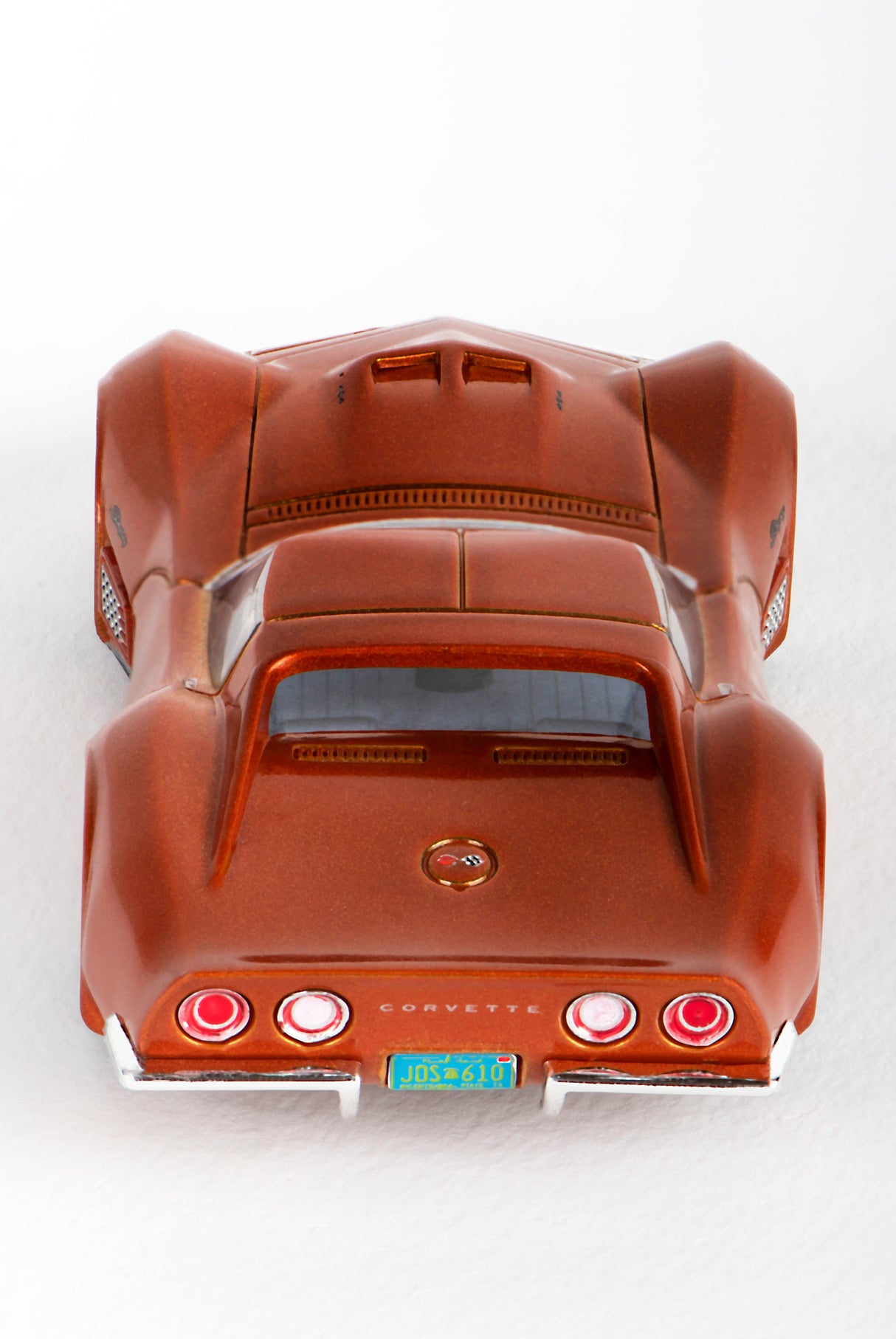 Brown slot car of a 1971 Corvette sports car viewed from the rear for AFX/Racemasters 22047