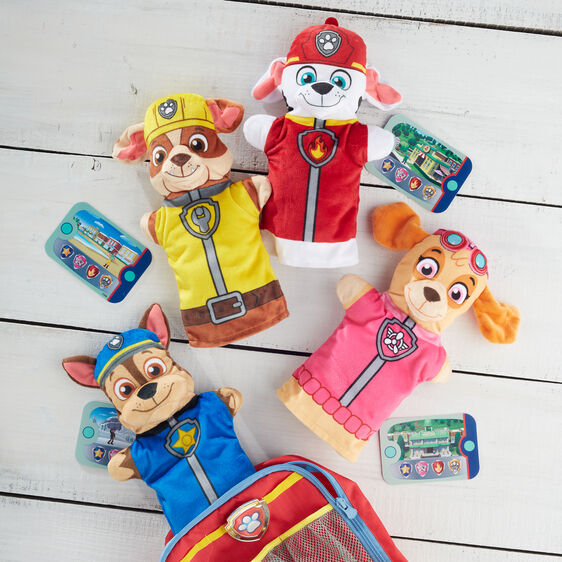 Assortment of PAW Patrol hand puppets on a white wooden surface for Melissa and Doug 33269