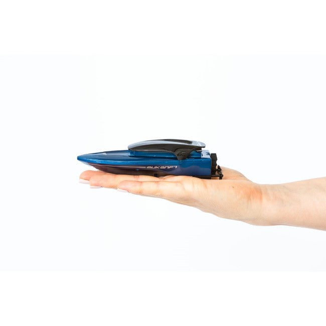 Blue remote-controlled mini boat held in a hand for Invento 500809