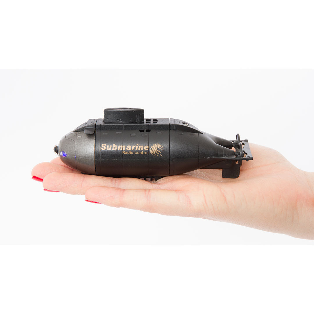 Black remote-controlled mini submarine held in a hand for Invento 500816