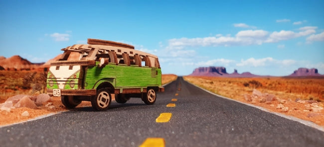 Wooden VW bus on a desert road under a blue sky for Wooden City 502380